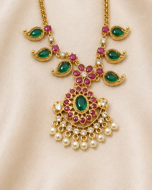 Modern mango-motif necklace with a red flower pendant and pearl-style drops